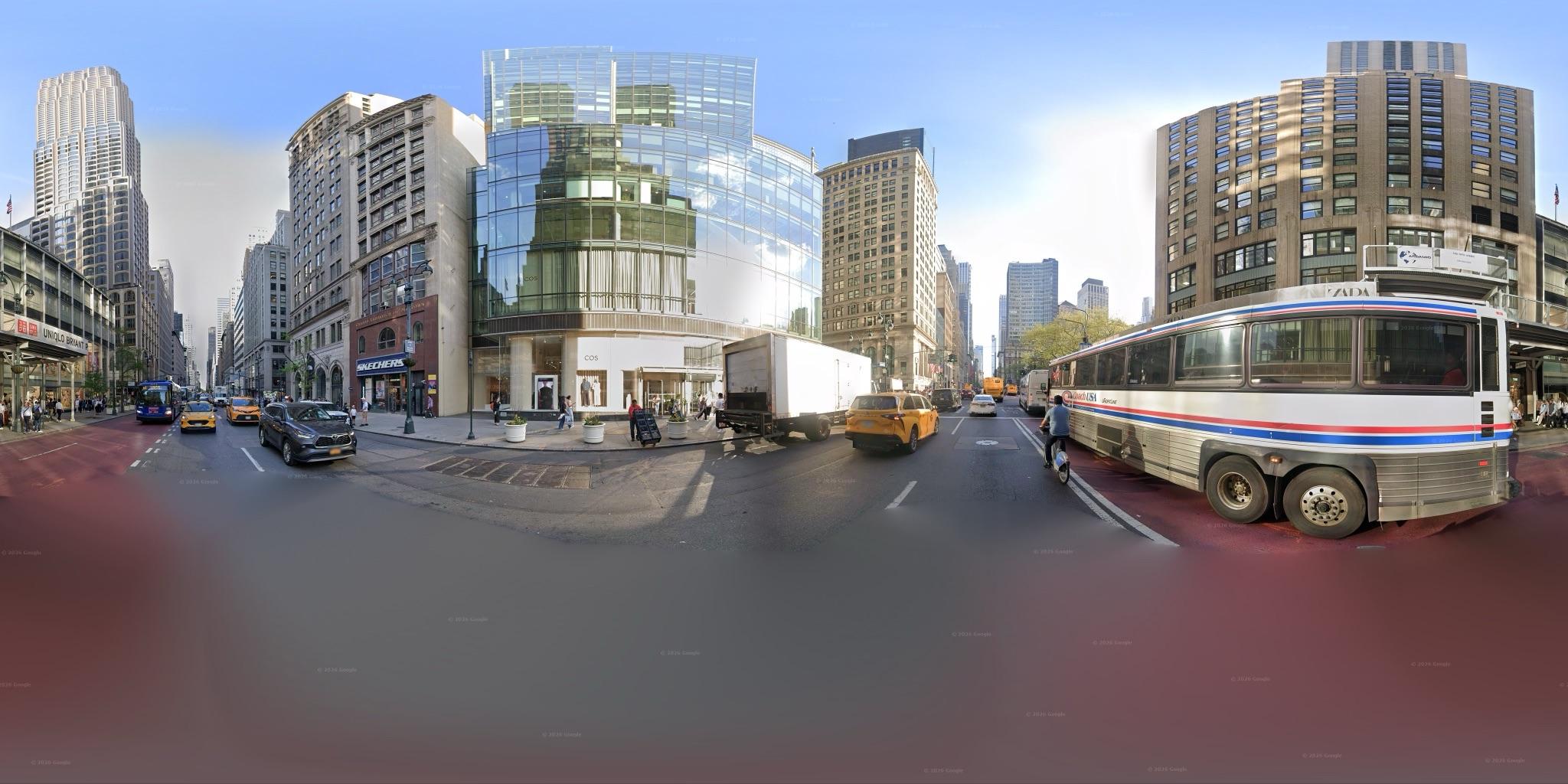 360 degree street-level panorama of Fifth Avenue in New York, showing buildings, traffic and pedestrians